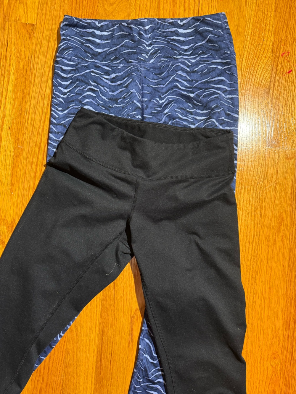 Zella Black and Athleta's blue-striped leggings.